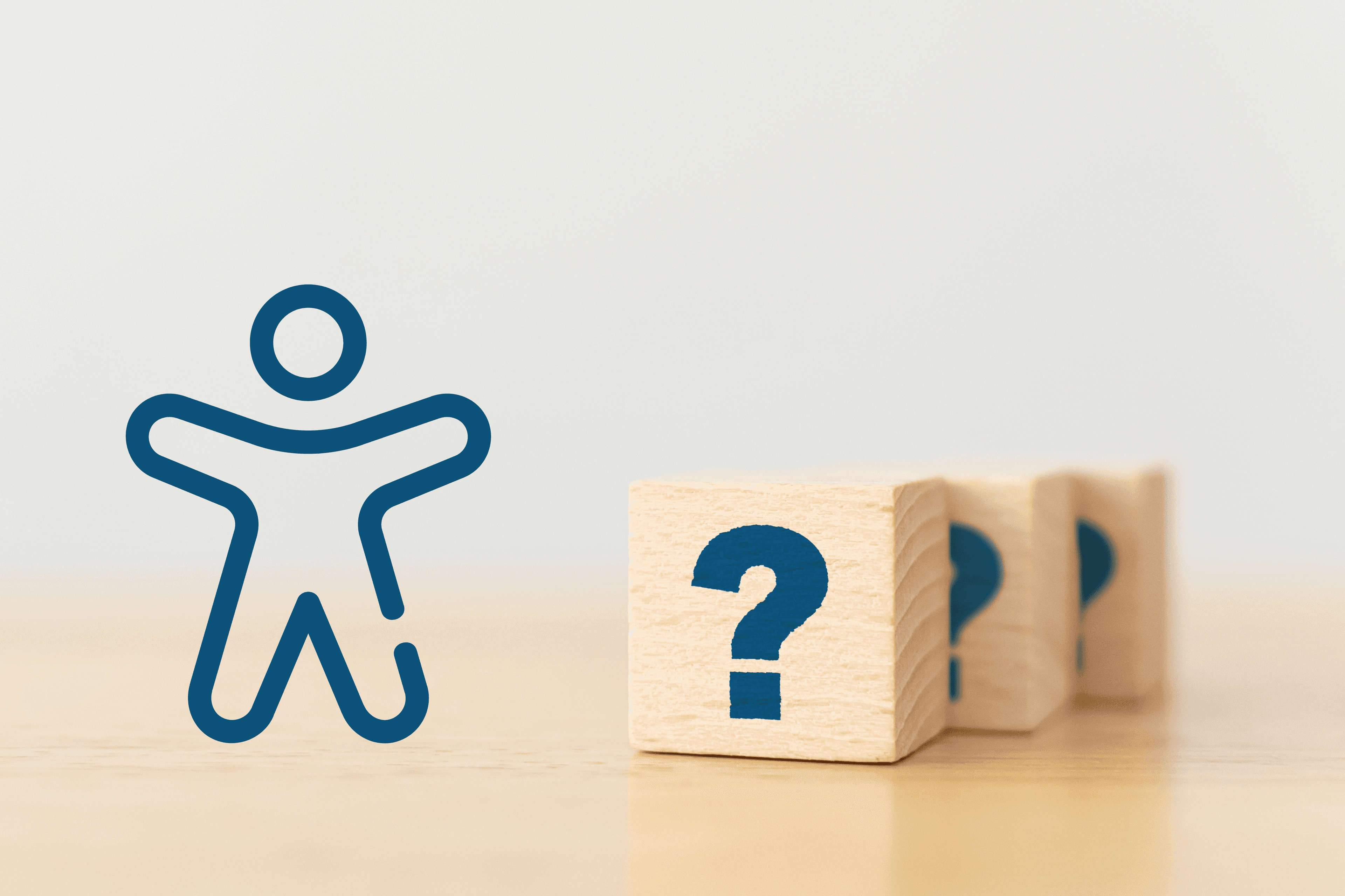 A blue figure icon beside three wooden blocks marked with question marks.